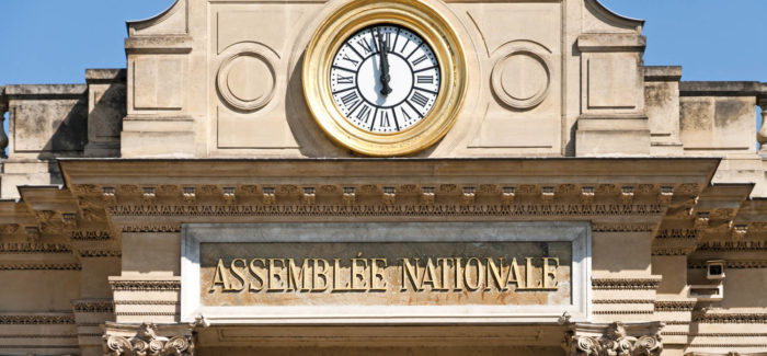 National Assembly in Paris. Sud facade entrance and clock. La loi de financement de la sécurité sociale pour 2021 : Quelles nouveautés sociales pour les entreprises ?