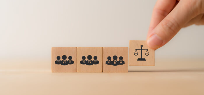 Compliance with employment laws and regulations, labor laws concept. Laws aim to protect workers from discrimination, harassment, unsafe working. Business ethics. La loi élargit l’action de groupe à tous les domaines en droit du travail